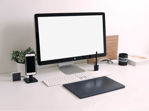 Computer Mockup With An Iphone On A Table