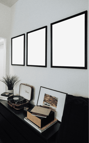 Three Movie Poster Mockups Hanging On Wall