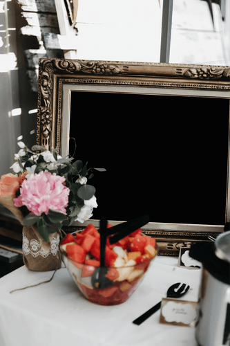Square Frame Mockup On A Table With Flowers