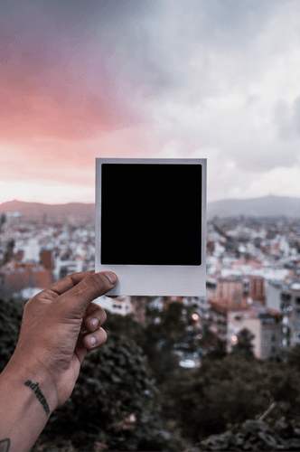 Hand Holding Postcard Mockup