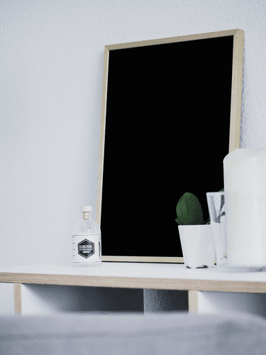 Gold Frame Mockup Standing On A Table